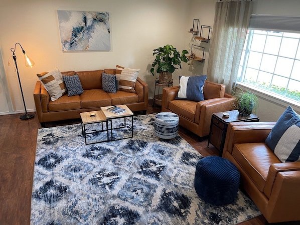 Entry level living room with supple comfortable couches and chairs 