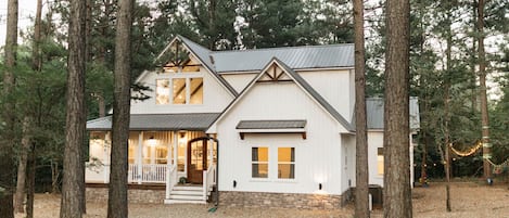 Once you turn the corner, you begin to see Cottonwood Cottage through the trees.  