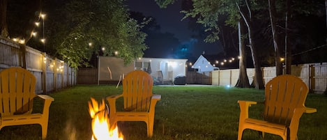 Nothing better than cozying up by the fire.. enjoy a private firepit in our fenced in backyard. 