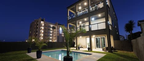 Outdoor view of the house with pool