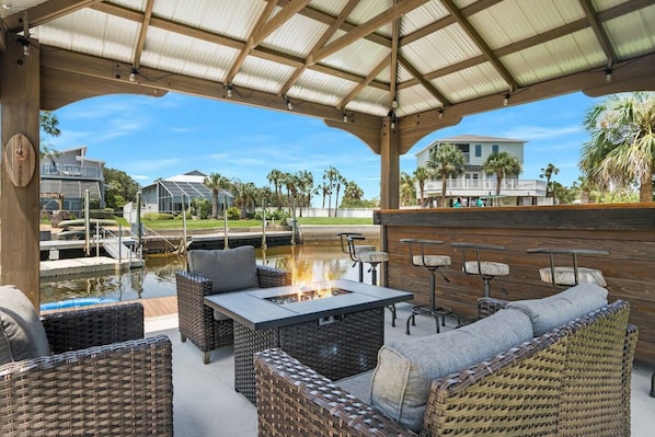 Gazebo with fire pit table and bar