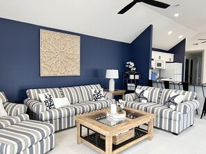 Beautiful coastal living room with a pull out full size sofa bed