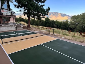 Private pickleball court with lake views. 