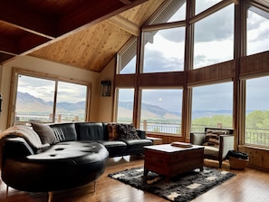 Great Room with fireplace and views of Pineview Resevoir and the Wasatch Mountains.