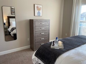 Another view of the cozy bedroom - surprisingly spacious, with an amazing new mattress from Winkbeds and dreamy Frette linens. The dresser and walk-in closet offer plenty of storage - perfect for longer stays. 