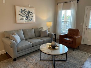 Another view of the living room. Lots of natural light! The door shown leads to the patio.