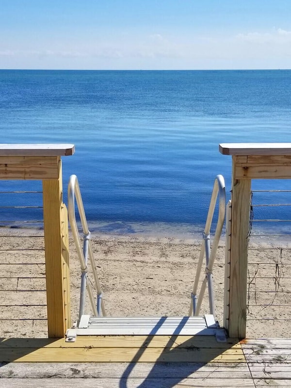 Stairs to beach from common area at low tide