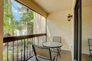 The Front Screened Lanai Has an Outdoor Dining Set