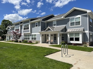 Outside of condo with bike rack.