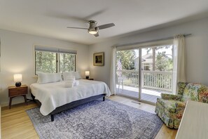 upper level master bedroom with private bathroom and slider to 2nd level deck