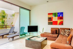 Plenty of lounge space with one TV to enjoy together time w/ your group