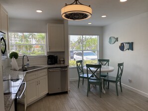 Full kitchen with dining area.