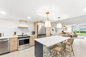 Sleek modern kitchen with high-end appliances and an inviting island
