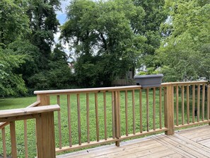 Summer view of the back yard with wrap around deck! You feel so secluded!