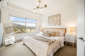 The master bedroom has a luxurious King size bed, full length mirror, TV