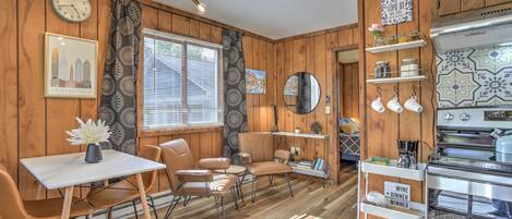 Your view of the open-concept and well-furnished cottage upon entering