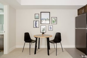 Enjoy your meals at the sleek dining table set for two