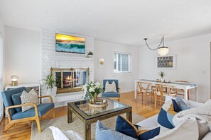 Gas fire place hardwood floors, with long table dinners