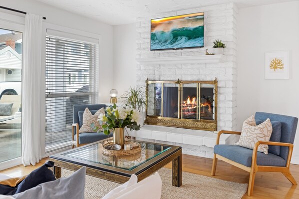 Indoor outdoor living, gas fire place hardwood floors.