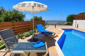Comfy sunbathing around the pool