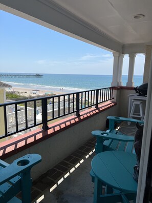 Balcony view of the ocean, beach and pier