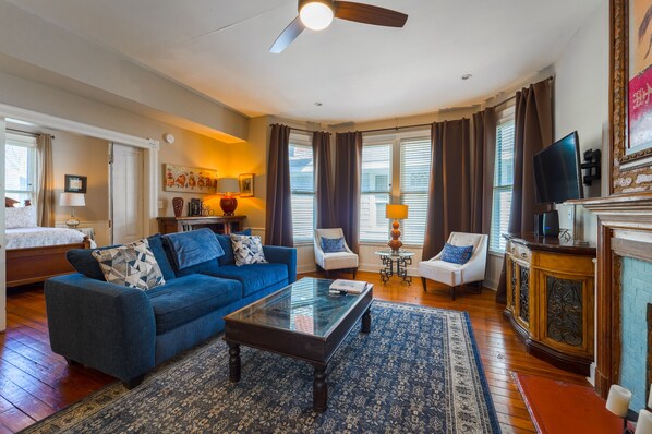 You enter into this spacious living room with huge windows brightening the room