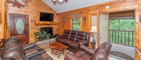 View of living room. The door leads you out onto the covered deck