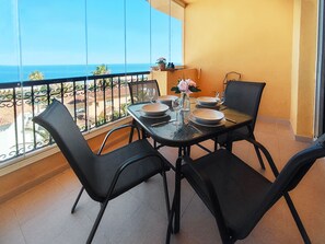 Balcony with retractable glass curtains