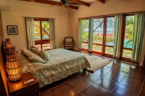 Downstair Master bedroom overlooking beach and pool 