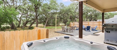 The backyard has a hot tub and plenty of seating perfect for entertaining