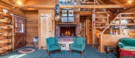 main level living room with wood burning fireplace