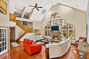 **Living room**  bring on the light! The airy living room offers a ton of natural light. Hang out on the couches for game or movie night or just spend quality time together around the gas fireplace.