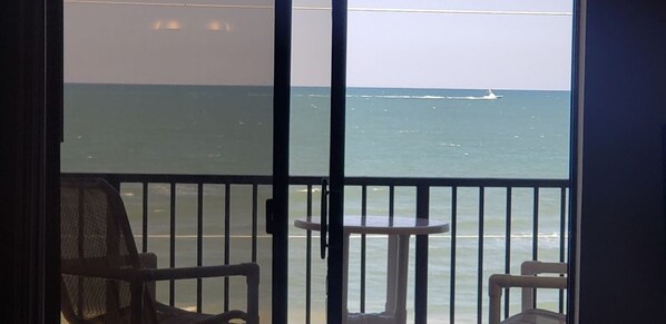 View of ocean from living room, primary and secondary bedroom. 