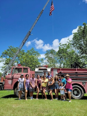 Firetruck group shot of our first-ever Pond House guests! A free 30-60 minute ride on our vintage firetruck is available for all guests, weather permitting. These make a great prop for taking group photos as well!