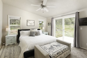 Your perfectly-positioned master bedroom with access to the back deck and hot tub.