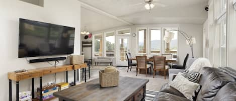 Open-concept living/dining room with smart TV