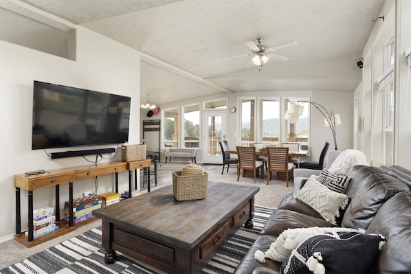 Open-concept living/dining room with smart TV