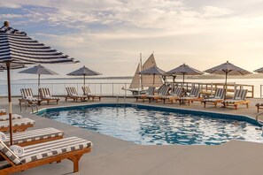Soak in coastal serenity with sun-drenched loungers and tranquil ocean breezes.