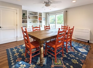 Dining room with slider to back deck and table that can expand to seat 10