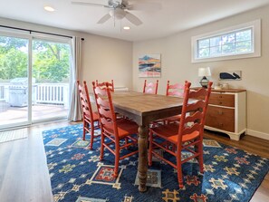 Dining room with slider to back deck and table that can expand to seat 10