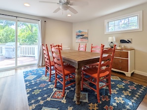 Dining room with slider to back deck and table that can expand to seat 10