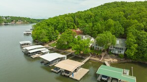 Your dock is left of the dock with the green roof and has a large swim platform.