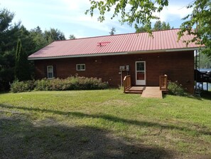The front entrance, with ample space for parking on the side.