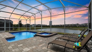 Private pool with serene lake view for ultimate relaxation.