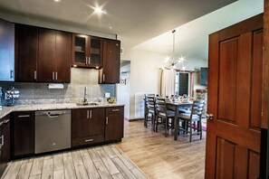 This beautifully remodeled kitchen is fully stocked and a perfect place to entertain!