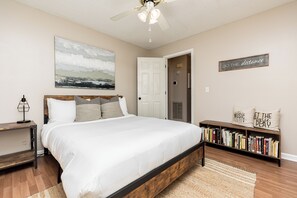 Bedroom 2 w/ queen sized bed, dedicated workspace & smart TV [includes streaming capabilities]
