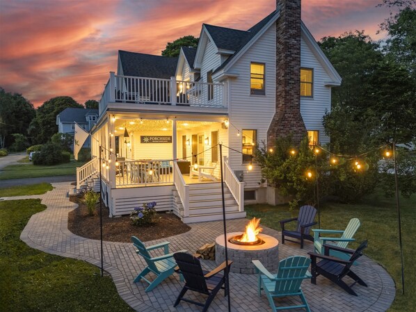 Porchside exterior at dusk with firepit