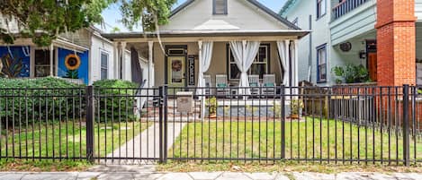 Front porch and backyard are fully fenced. Street Parking is in front of house