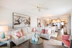 Living area with sectional sofa and television.