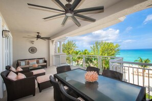 Furnished balcony with oceanfront views.